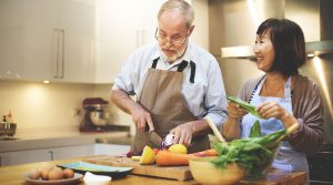 A old couple prepare for cooking food in kitchen